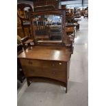 An Arts and Crafts oak dressing table having copper handles, width approx. 99cm