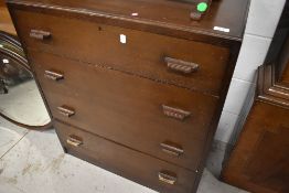 An early to mid 20th Century oak and ply bedroom chest of four long drawers, width approx. 76cm