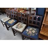 A set of four early 20th Century oak cullice back dining chairs