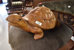 A carved wooden turtle or tortoise, (we've named it Terri/Terry as it's terrifically tactile),