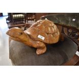 A carved wooden turtle or tortoise, (we've named it Terri/Terry as it's terrifically tactile),