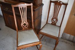 A pair of mahogany carved back dining chairs having cabriole legs