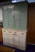 A late 19th or early 20th Century pantry or utility cupboard with dresser base in painted pine 140cm