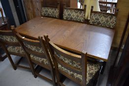 A dining room table and set of six chairs by Old Charm
