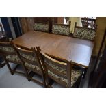 A dining room table and set of six chairs by Old Charm