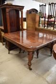 A 19th Century mahogany dining/banquetting table in the Gillow style being of very high quality,