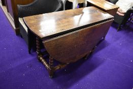 A Period oak gateleg dining table having bobbin turned style frame