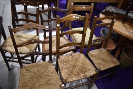 A selection of six dining and salon bedroom chairs in various designs including rush seated and
