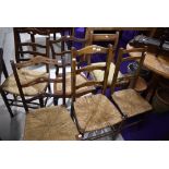 A selection of six dining and salon bedroom chairs in various designs including rush seated and