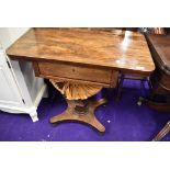 A mid Victorian rosewood sewing or craft table having pedestal base with double under drawer