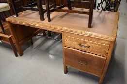 A mid 20th Century golden oak office desk, drawer stamped WBE width approx. 153cm