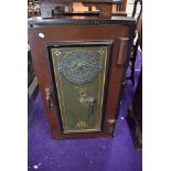 A cast iron safe by Milner's Thief Resisting and Strong Hold Fast Safe Key included