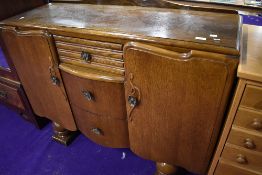 A mid 20th Century oak and ply sideboard, width approx. 122cm