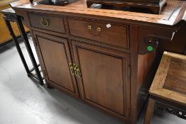 An Oriental hardwood sideboard/buffet/bar, approx dimensions. W128 H94 D46cm (one handle off but