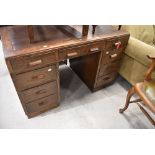 An early 20th Century oak pedestal desk