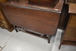 An early 20th Century oak gateleg table, width approx. 96cm