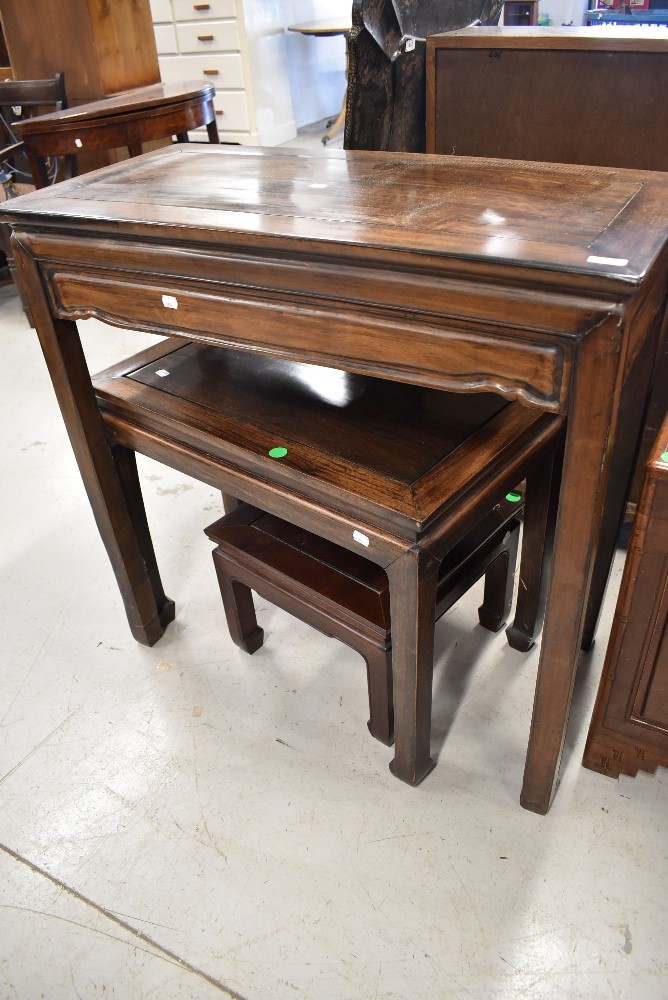 Three Oriental hardwood occasional side tables of similar design and reducing sizes, W89,68 and 40cm