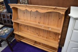 A modern yellow pine kitchen plate rack or shelf unit