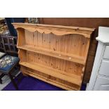 A modern yellow pine kitchen plate rack or shelf unit