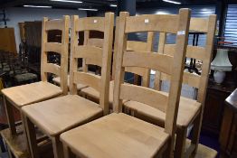 A set of six solid ladder back kitchen chairs