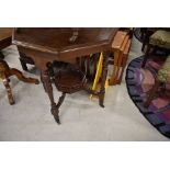 A Victorian mahogany occasional table having octagonal top and galleried undertier