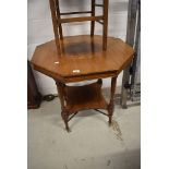 A late Victorian mahogany octagonal occasional table having undertier, on turned legs and cross