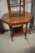 A late Victorian mahogany octagonal occasional table having undertier, on turned legs and cross