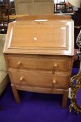 A 1930s Arts and Crafts style golden oak bureau, made at Brynmawr factory of Jim Forrester, designed