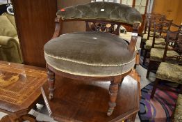 A Victorian mahogany tub chair having later dralon upholstery