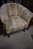 A traditional tub chair, probably early 20th Century with later upholstery