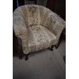 A traditional tub chair, probably early 20th Century with later upholstery