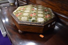 A Victorian octagonal footstool, some signs of past worm to some of the beading