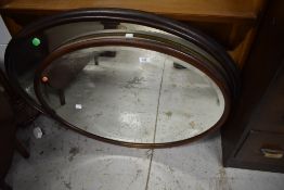 Two early 20th Century oval wall mirrors