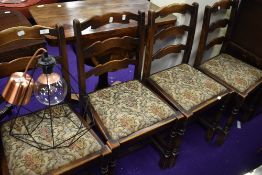 A set of mid 20th Century ladder back dining chairs