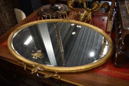 A regency style mantle mirror having gilt and gesso frame