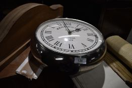 A reproduction station clock in Chrome effect case