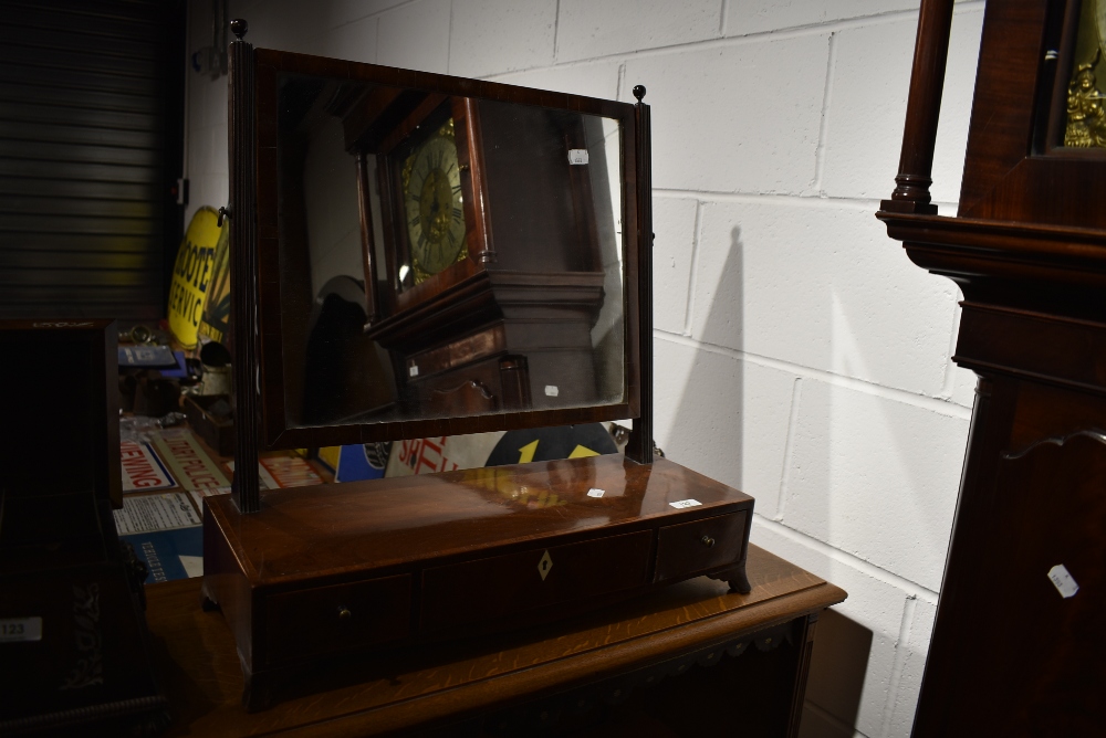An early 20th Century mahogany toilet mirror having drawer base