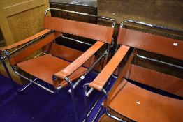 A pair of mid century design armchairs in tubular chrome and leather, probably P E L - Practical