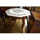 A marble top octagonal occasional table with inlaid decoration including mother of pearl, on