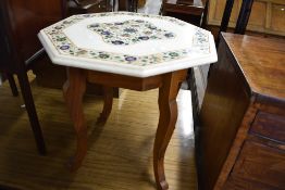 A marble top octagonal occasional table with inlaid decoration including mother of pearl, on