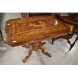 A Continental side table having typical marquetry work , probably Italian with central