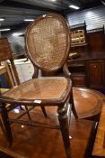 A Victorian bedroom or salon chair having balloon back and woven fibre seat