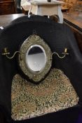 A Victorian hall way mirror having ornate ormolu frame with twin candle stems and oval mirror