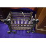 A cast iron ingle nook open fire grate 49cm wide by 34cm deep