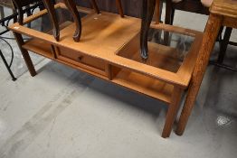 A vintage teak and glass coffee table, labelled G Plan