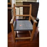 A small sized child's beech wood framed arm chair