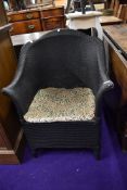 A woven fibre conservatory tub chair having shaped seat