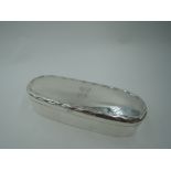 An Edwardian oval silver trinket box having crimped rim to hinged lid bearing monogram G, Birmingham