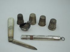 A small selection of HM silver including an Edwardian chatelaine pencil, folding fruit knife,