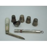 A small selection of HM silver including an Edwardian chatelaine pencil, folding fruit knife,